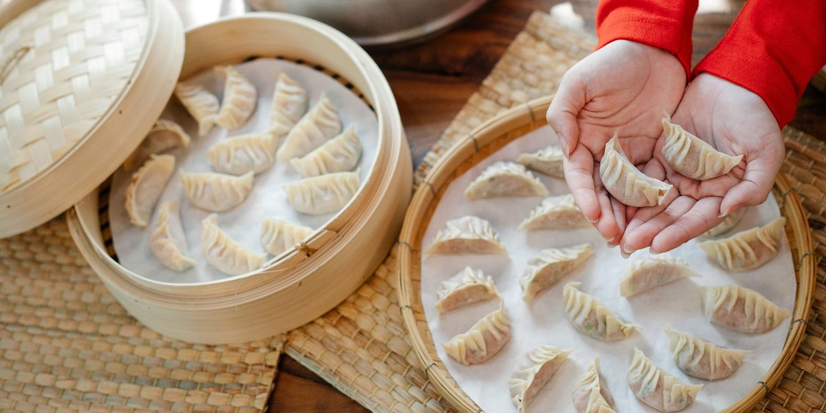 Steamer baskets of freshly made dumplings